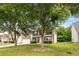 Beautiful two-story home with mature trees in the front yard and a well-manicured lawn at 1492 Saint George, Conyers, GA 30012