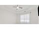 Bright bedroom with a tray ceiling and large window at 1680 Bluestone Dr, Cumming, GA 30041