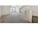 Spacious bonus room with high ceilings, ceiling fan, and carpeted floor at 1680 Bluestone Dr, Cumming, GA 30041