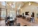 Spacious clubhouse with high ceilings, tables, chairs, and hardwood floors at 1680 Bluestone Dr, Cumming, GA 30041