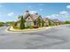 Charming clubhouse exterior with well-maintained landscaping and parking at 1680 Bluestone Dr, Cumming, GA 30041