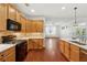 Bright eat-in kitchen featuring wooden cabinets, stainless steel appliances, and hardwood flooring at 1680 Bluestone Dr, Cumming, GA 30041