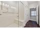 Bathroom shower with glass door and built-in seat at 1680 Bluestone Dr, Cumming, GA 30041