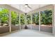 Enclosed sunroom offering scenic views of the surrounding greenery at 1680 Bluestone Dr, Cumming, GA 30041