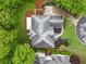 Stunning aerial view of house highlighting roof, patio, landscaping, and driveway at 2321 Edgemere Lake Cir, Marietta, GA 30062