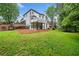 Well-manicured backyard featuring a white deck and covered patio, perfect for entertaining at 2321 Edgemere Lake Cir, Marietta, GA 30062
