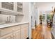 Wet bar featuring a sink, countertop, and cabinetry, adjacent to the breakfast nook at 2321 Edgemere Lake Cir, Marietta, GA 30062