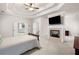 Spacious main bedroom with a tray ceiling, a fireplace and a sitting area at 2321 Edgemere Lake Cir, Marietta, GA 30062