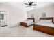 Bedroom featuring two beds, neutral carpet, and access to an on-suite bathroom at 2321 Edgemere Lake Cir, Marietta, GA 30062
