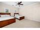Bedroom featuring two beds with wooden frames, carpeted floors, and neutral walls at 2321 Edgemere Lake Cir, Marietta, GA 30062