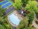 Aerial perspective of community amenities including tennis courts and a swimming pool at 2321 Edgemere Lake Cir, Marietta, GA 30062