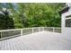 Spacious, white deck offers a serene outdoor space with lush green surroundings at 2321 Edgemere Lake Cir, Marietta, GA 30062