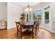 Bright dining room features hardwood floors, modern lighting and multiple windows offering beautiful views at 2321 Edgemere Lake Cir, Marietta, GA 30062