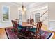 Dining room with hardwood floors, large window, and a view into the foyer at 2321 Edgemere Lake Cir, Marietta, GA 30062