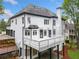 Rear elevation of home showing white deck, patio, and yard at 2321 Edgemere Lake Cir, Marietta, GA 30062