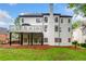 Rear elevation of home showing deck, patio, and lawn at 2321 Edgemere Lake Cir, Marietta, GA 30062