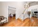 Spacious foyer with hardwood floors, staircase, and views into the office and living room at 2321 Edgemere Lake Cir, Marietta, GA 30062