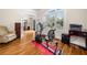 Spacious workout room with hardwood flooring, natural light, and exercise equipment at 2321 Edgemere Lake Cir, Marietta, GA 30062