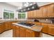 Gourmet kitchen boasts custom cabinets, granite countertops, modern stainless steel appliances, and a central island at 2321 Edgemere Lake Cir, Marietta, GA 30062