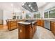 Gourmet kitchen boasts custom cabinets, granite countertops, modern stainless steel appliances, and a central island at 2321 Edgemere Lake Cir, Marietta, GA 30062