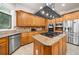Gourmet kitchen boasts custom cabinets, granite countertops, modern stainless steel appliances, and a central island at 2321 Edgemere Lake Cir, Marietta, GA 30062