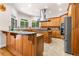 Gourmet kitchen boasts custom cabinets, granite countertops, modern stainless steel appliances, and a central island at 2321 Edgemere Lake Cir, Marietta, GA 30062