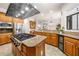 Gourmet kitchen boasts custom cabinets, granite countertops, modern stainless steel appliances, and a central island at 2321 Edgemere Lake Cir, Marietta, GA 30062
