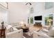 The spacious living room has a fireplace, a large ceiling fan, and a comfortable seating area at 2321 Edgemere Lake Cir, Marietta, GA 30062