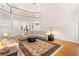 Bright living room with hardwood floors, area rug and a large comfortable sectional sofa at 2321 Edgemere Lake Cir, Marietta, GA 30062