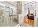 Main bathroom featuring glass shower, linen closet, and doorway to bedroom at 2321 Edgemere Lake Cir, Marietta, GA 30062