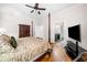 Traditional main bedroom with a four poster bed, tv, and access to en suite at 2321 Edgemere Lake Cir, Marietta, GA 30062