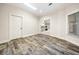 Office space with decorative flooring and bright lighting with a view to kitchen at 2321 Edgemere Lake Cir, Marietta, GA 30062