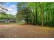 Picturesque park featuring mature trees, a shelter with benches, and an expansive open space at 2321 Edgemere Lake Cir, Marietta, GA 30062