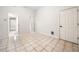 Empty room with tile flooring and three white doors at 2321 Edgemere Lake Cir, Marietta, GA 30062