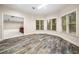 Sunroom featuring decorative floors and lots of natural light from windows and an open archway at 2321 Edgemere Lake Cir, Marietta, GA 30062