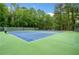 Bright and spacious tennis courts offer an active lifestyle with lush green surroundings, creating a recreational haven at 2321 Edgemere Lake Cir, Marietta, GA 30062
