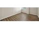Bright bedroom features wood-look flooring and neutral paint, with a large window for natural light at 2965 Pharr Court South Nw # 718, Atlanta, GA 30305