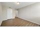 Inviting bedroom with wood-look flooring, neutral paint, and closet at 2965 Pharr Court South Nw # 718, Atlanta, GA 30305