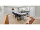 Bright communal dining area with a large table, multiple chairs, and a kitchen area at 2965 Pharr Court South Nw # 718, Atlanta, GA 30305