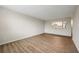 A bright living room features hard wood floors and a pass through view into the kitchen at 2965 Pharr Court South Nw # 718, Atlanta, GA 30305