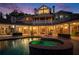 Backyard oasis featuring a sparkling pool, spa, and covered patio seating area at 320 Riverbend Dr, Mcdonough, GA 30252