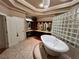Luxurious bathroom featuring a standalone tub and glass block shower at 320 Riverbend Dr, Mcdonough, GA 30252