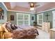 Bedroom with large windows allowing natural light, neutral carpeting, and a decorative color scheme at 320 Riverbend Dr, Mcdonough, GA 30252