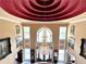 Elegant foyer featuring a stunning chandelier, large window and curved ceiling at 320 Riverbend Dr, Mcdonough, GA 30252
