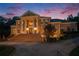 Stately brick home featuring a grand entrance, mature landscaping, and circular driveway at 320 Riverbend Dr, Mcdonough, GA 30252