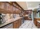 Gourmet kitchen featuring stainless steel appliances, granite countertops, and custom cabinetry at 320 Riverbend Dr, Mcdonough, GA 30252