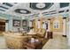 Sophisticated living room with elegant decor, chandeliers, and decorative columns at 320 Riverbend Dr, Mcdonough, GA 30252