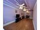 Living room with a TV, fireplace, and laminate floors at 320 Riverbend Dr, Mcdonough, GA 30252