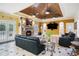 Open-concept living area with wood ceiling, brick fireplace, media center, and views of the outdoors at 320 Riverbend Dr, Mcdonough, GA 30252