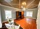 Bright sauna room featuring a wooden sauna, hardwood floors, and rocking chairs at 320 Riverbend Dr, Mcdonough, GA 30252